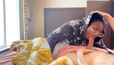 Ebony teen with a cute face fucks her own brown dick