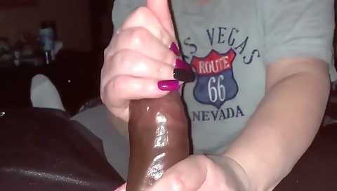 A mature woman in a black dress fucks in her mouth