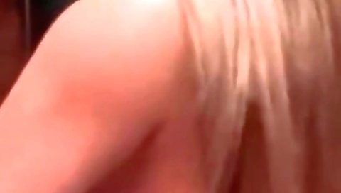 Busty blonde in a pink dress is taking on two black cocks